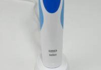 white and blue oral-b pro 500 on the table